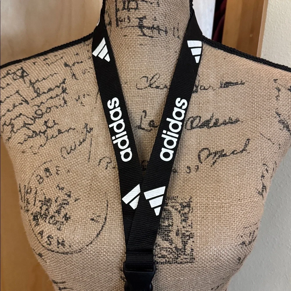 Barely used authentic ADIDAS lanyard with pinch clip off section on bottom.